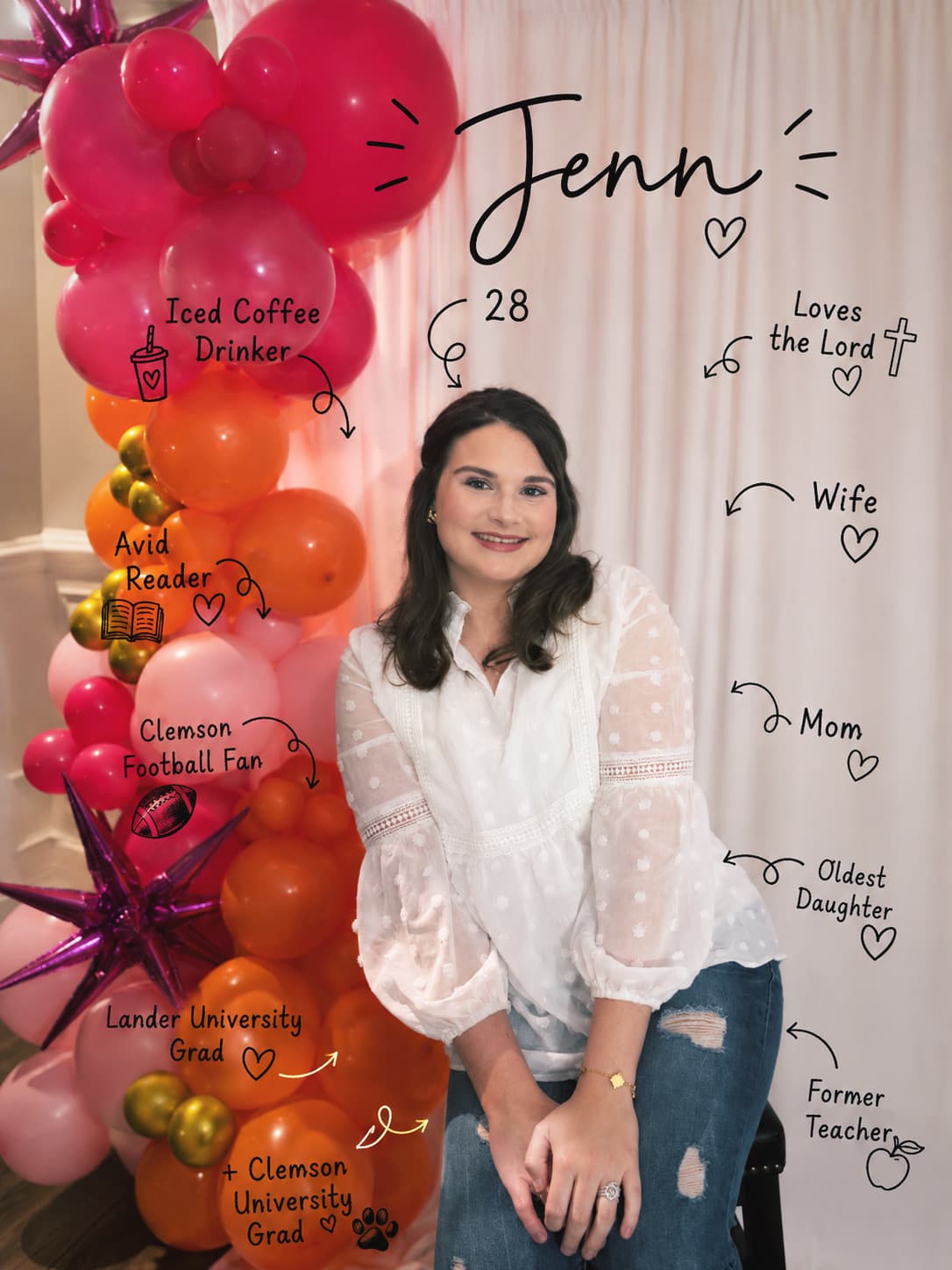 Jenn, owner and creative designer at Jenn Brings Joy, in front of a pink and orange balloon garland